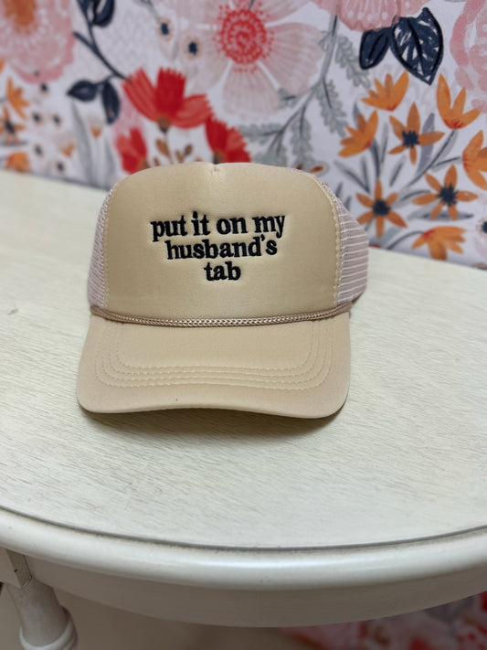 Put It On My Husband's Tab Trucker Hat