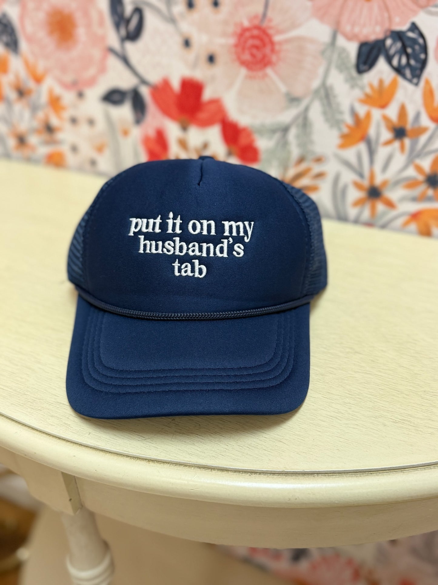 Put It On My Husband's Tab Trucker Hat
